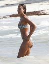 thumb_Jessica_Alba_-_wearing_a_bikinis_at_a_beach_in_Mexico_033.jpg