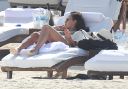 thumb_Jessica_Alba_-_wearing_a_bikinis_at_a_beach_in_Mexico_119.jpg