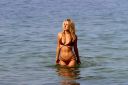 thumb_Kimberley_Garner_wearing_a_bikini_in_St_Tropez_021.jpg