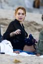 thumb_Lindsay_Lohan_-_wearing_a_bikini_top_at_a_beach_in_California_026.jpg