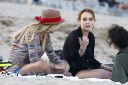 thumb_Lindsay_Lohan_-_wearing_a_bikini_top_at_a_beach_in_California_027.jpg