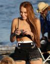 thumb_Lindsay_Lohan_-_wearing_a_bikini_top_at_a_beach_in_California_050.JPG