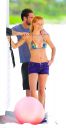 thumb_Michelle_Hunziker_bikini_at_the_Beach_in_Miami_017.jpg