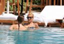 thumb_Michelle_Hunziker_bikini_at_the_Beach_in_Miami_023.jpg