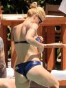 thumb_Michelle_Hunziker_bikini_at_the_Beach_in_Miami_031.jpg