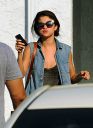 thumb_Selena_Gomez_-_cleavage_and_leggy_at_a_tanning_salon_in_Florida_016.jpg