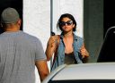 thumb_Selena_Gomez_-_cleavage_and_leggy_at_a_tanning_salon_in_Florida_017.jpg
